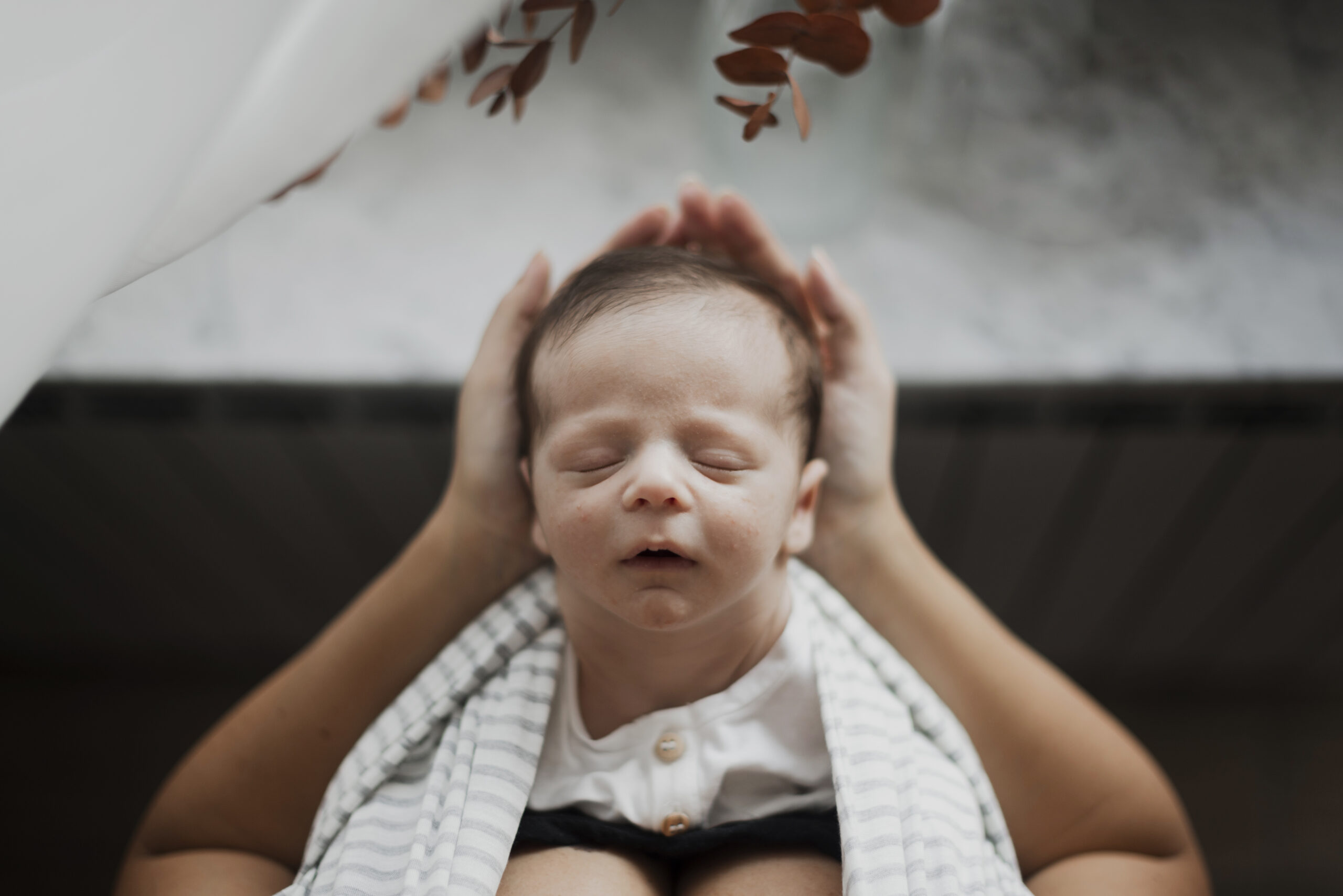 top-view-little-baby-sleeping-mother-hands